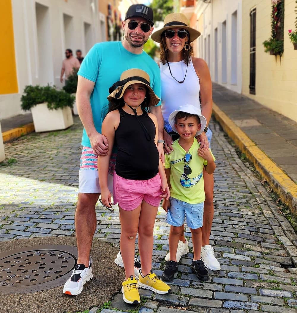 A family of four on a cobblestone street in Old San Juan